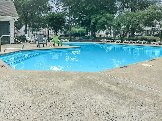 10548 English Setter Way, Charlotte, NC 28269 - community pool featuring a patio