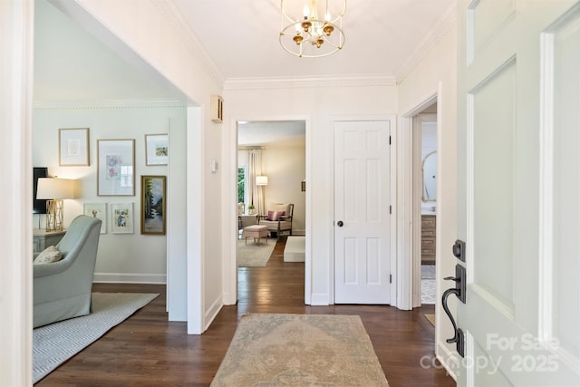 7022 Lancer Dr, Charlotte, NC 28226 - entrance foyer featuring a chandelier, dark wood-style floors, and ornamental molding