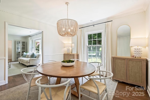 7022 Lancer Dr, Charlotte, NC 28226 - dining space with wood finished floors, crown molding, and a chandelier