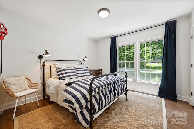 7022 Lancer Dr, Charlotte, NC 28226 - bedroom featuring baseboards and wood finished floors