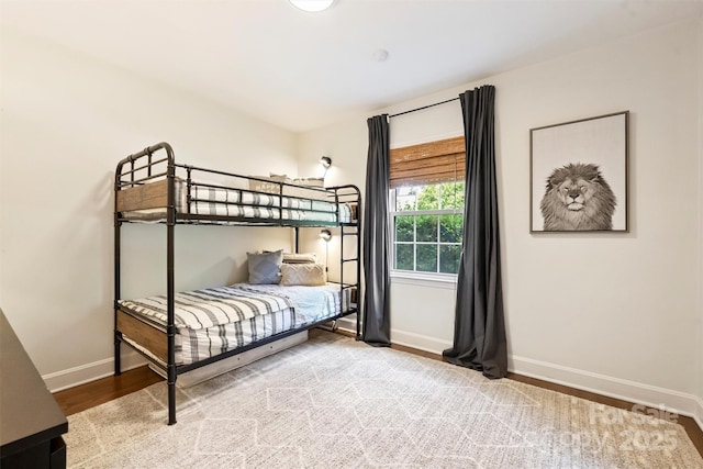 7022 Lancer Dr, Charlotte, NC 28226 - bedroom with baseboards and wood finished floors
