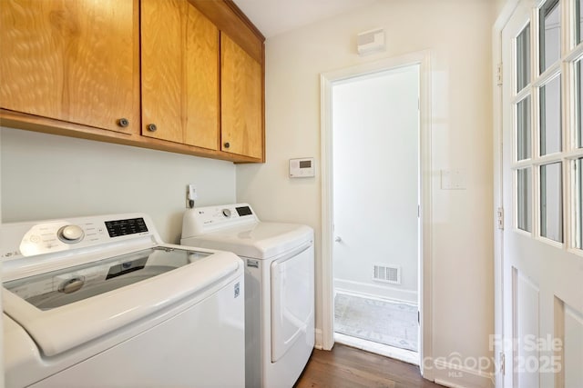 7022 Lancer Dr, Charlotte, NC 28226 - laundry room with cabinet space, washer and clothes dryer, and dark wood finished floors