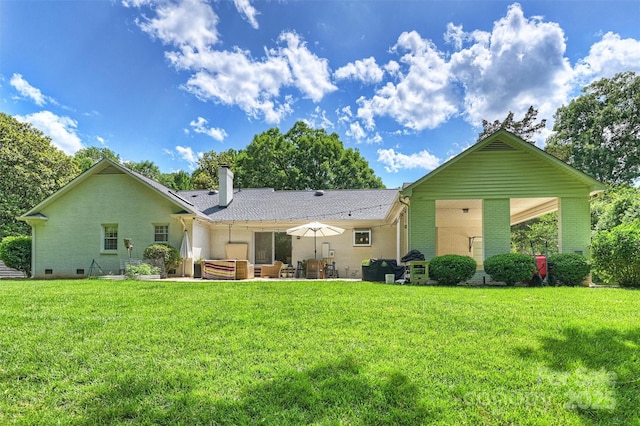 7022 Lancer Dr, Charlotte, NC 28226 - back of house with a lawn, a patio area, a chimney, and brick siding