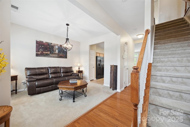 444 Battery Cir, Clover, SC 29710 - living room with light wood-style floors, stairs, and a chandelier