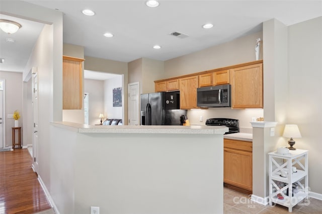 444 Battery Cir, Clover, SC 29710 - kitchen featuring black appliances, light countertops, a peninsula, and recessed lighting