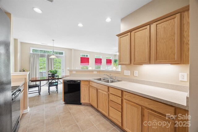 444 Battery Cir, Clover, SC 29710 - kitchen featuring black appliances, light countertops, a peninsula, light tile patterned floors, and hanging light fixtures