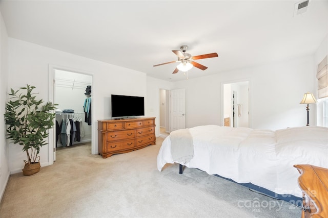 444 Battery Cir, Clover, SC 29710 - bedroom featuring light carpet, a walk in closet, a closet, and a ceiling fan