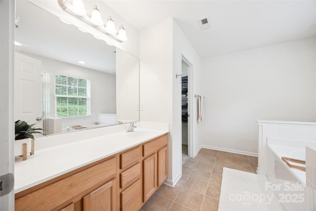 444 Battery Cir, Clover, SC 29710 - bathroom featuring vanity, a bath, and tile patterned floors