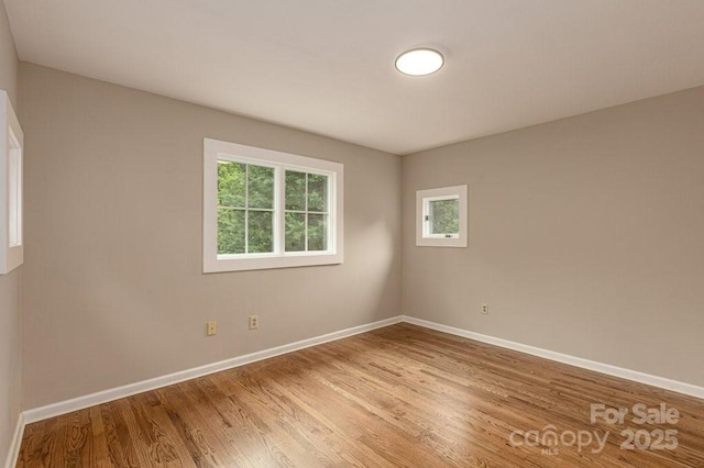 74 Eastmoor Dr, Asheville, NC 28805 - spare room with light wood-style floors and baseboards