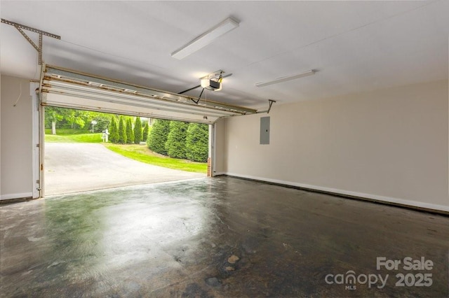 74 Eastmoor Dr, Asheville, NC 28805 - garage with electric panel, a garage door opener, and baseboards