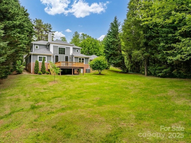 74 Eastmoor Dr, Asheville, NC 28805 - back of property featuring a wooden deck, a yard, a chimney, and brick siding