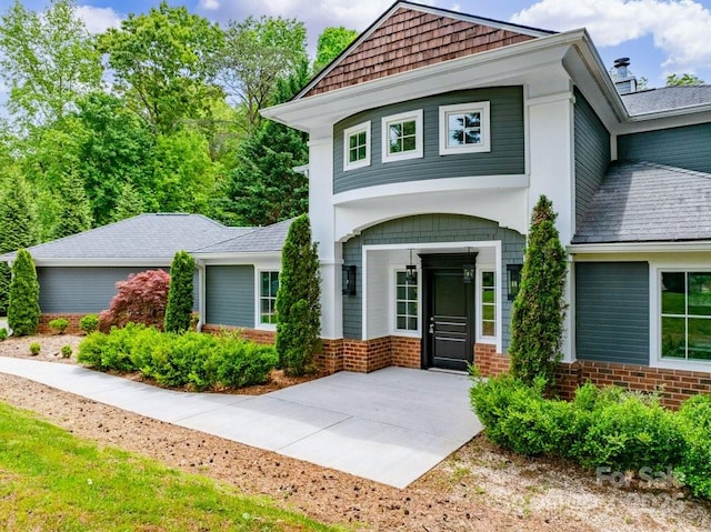 74 Eastmoor Dr, Asheville, NC 28805 - view of front of house featuring brick siding and a shingled roof