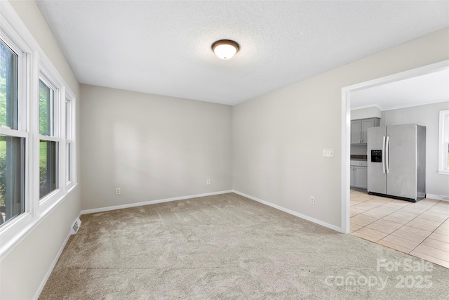 1606 Northwoods Dr, Kings Mountain, NC 28086 - unfurnished room featuring light colored carpet, baseboards, and a textured ceiling