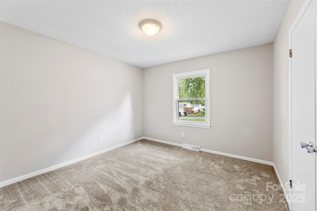 1606 Northwoods Dr, Kings Mountain, NC 28086 - carpeted spare room with a textured ceiling and baseboards