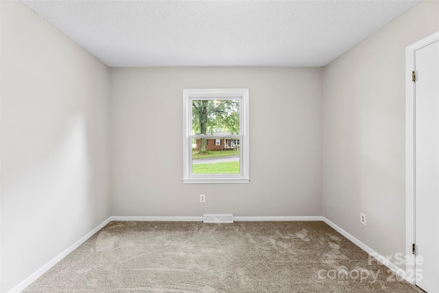 1606 Northwoods Dr, Kings Mountain, NC 28086 - carpeted empty room with baseboards and a textured ceiling