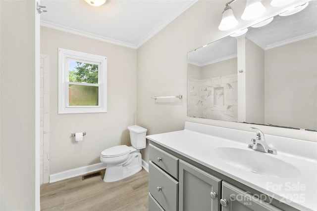 1606 Northwoods Dr, Kings Mountain, NC 28086 - bathroom with toilet, vanity, ornamental molding, wood finished floors, and baseboards