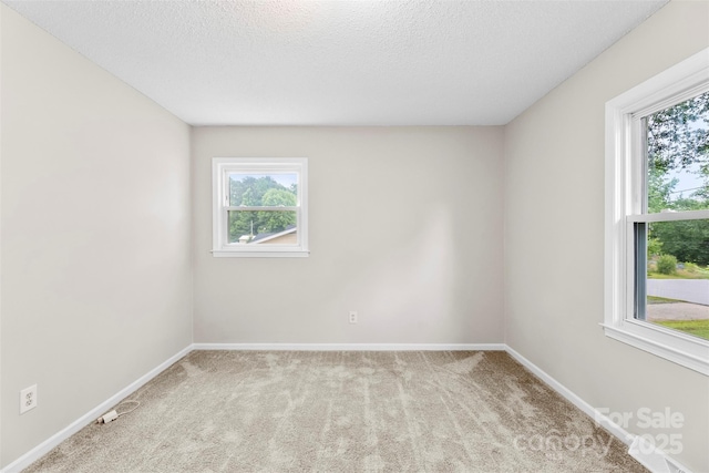1606 Northwoods Dr, Kings Mountain, NC 28086 - empty room featuring carpet floors, baseboards, and a textured ceiling