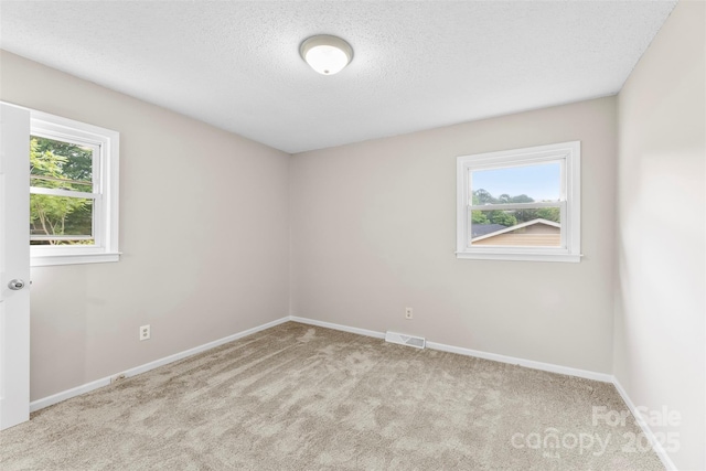 1606 Northwoods Dr, Kings Mountain, NC 28086 - empty room with carpet floors, baseboards, and a textured ceiling