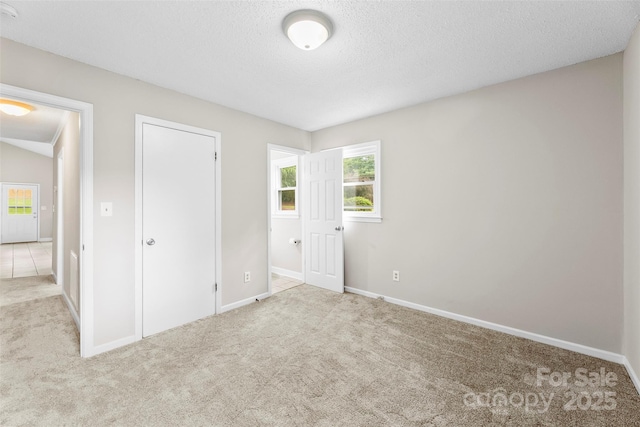 1606 Northwoods Dr, Kings Mountain, NC 28086 - unfurnished bedroom featuring carpet, baseboards, and a textured ceiling