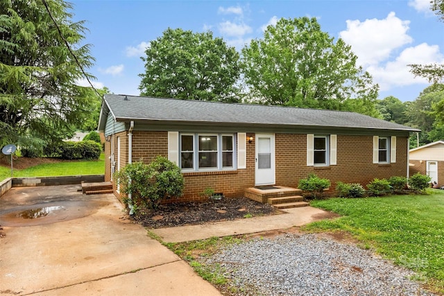 1606 Northwoods Dr, Kings Mountain, NC 28086 - ranch-style house with brick siding, driveway, a front yard, and roof with shingles