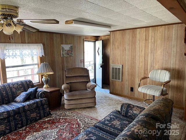 239 Laurel Dr, Whittier, NC 28789 - carpeted living area with healthy amount of natural light, wood walls, a ceiling fan, heating unit, and baseboards