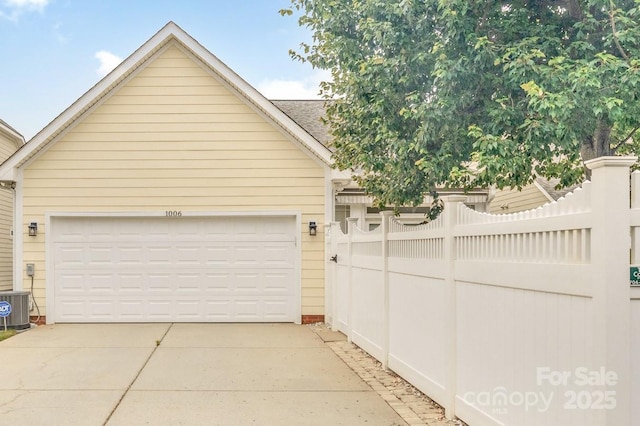 1006 Phar Lap Dr, Indian Trail, NC 28079 - garage featuring driveway and central air condition unit
