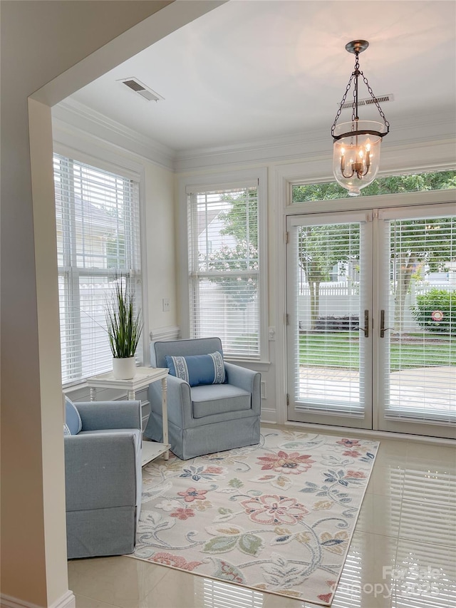 1006 Phar Lap Dr, Indian Trail, NC 28079 - tiled living area featuring plenty of natural light, a chandelier, and crown molding