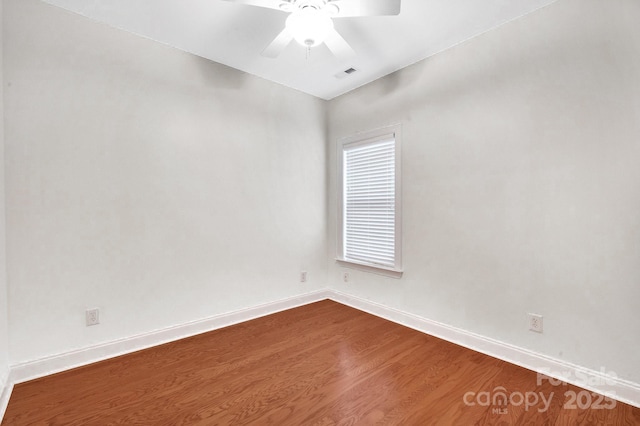 1006 Phar Lap Dr, Indian Trail, NC 28079 - empty room featuring a ceiling fan, baseboards, and dark wood-style floors