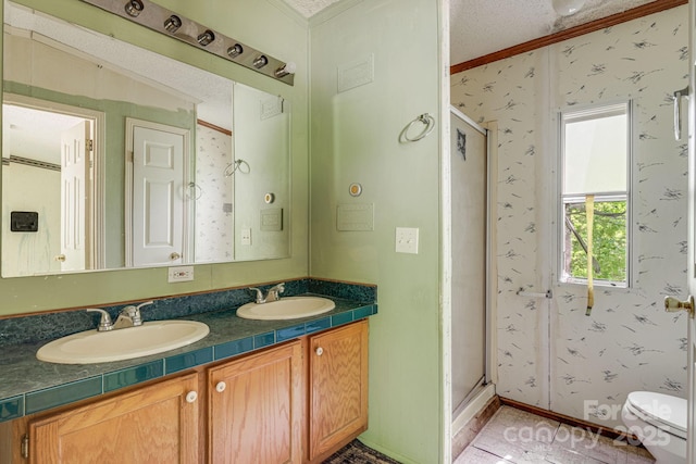 501 Deer Chase Cir, Cedar Mountain, NC 28718 - bathroom featuring crown molding, double vanity, a stall shower, wallpapered walls, and toilet
