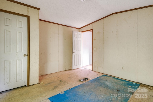 501 Deer Chase Cir, Cedar Mountain, NC 28718 - spare room featuring crown molding, a textured ceiling, and lofted ceiling