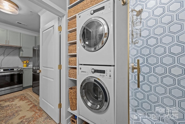 630 Calvert St Unit 111, Charlotte, NC 28208 - laundry room with stacked washer / drying machine and light wood finished floors