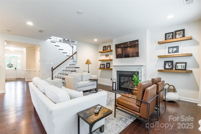 5130 Watersail Way, Clover, SC 29710 - living room featuring dark wood-type flooring, stairs, a fireplace with flush hearth, baseboards, and recessed lighting