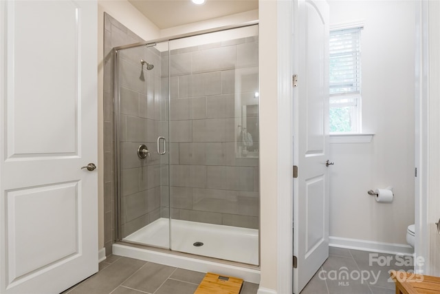 5130 Watersail Way, Clover, SC 29710 - bathroom featuring tile patterned flooring, baseboards, a shower stall, and toilet