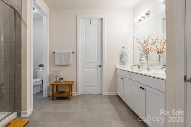 5130 Watersail Way, Clover, SC 29710 - bathroom featuring double vanity, a stall shower, toilet, baseboards, and tile patterned flooring