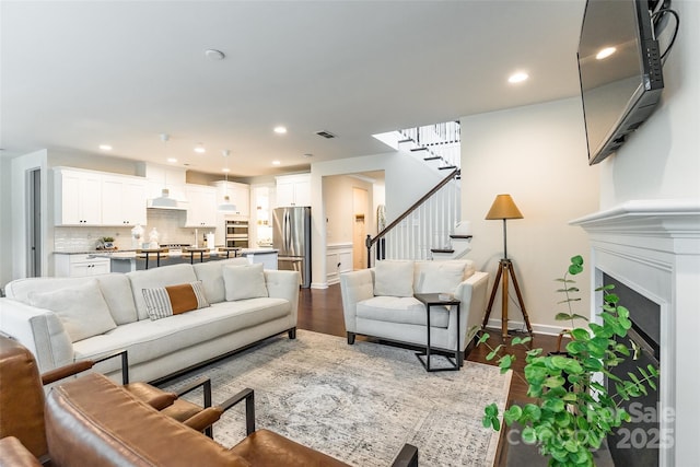 5130 Watersail Way, Clover, SC 29710 - living room featuring stairway, wood finished floors, recessed lighting, baseboards, and a fireplace