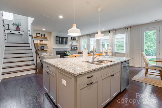 5130 Watersail Way, Clover, SC 29710 - kitchen featuring a sink, stainless steel dishwasher, dark wood finished floors, a fireplace, and light stone countertops