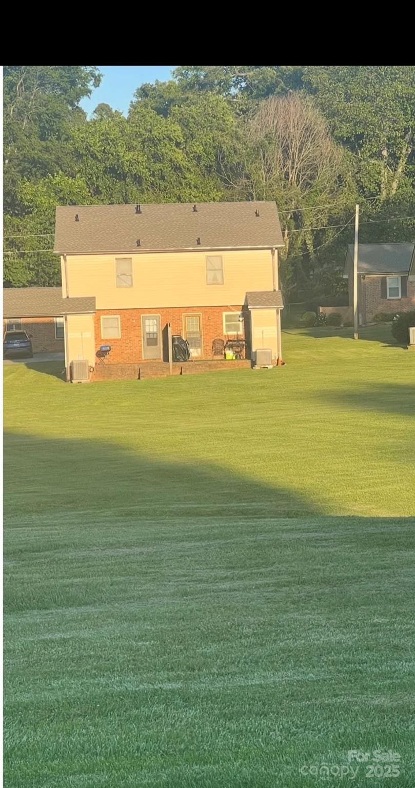 484 Willow Spring Ln Unit B, Rock Hill, SC 29730 - rear view of property with a lawn and central air condition unit