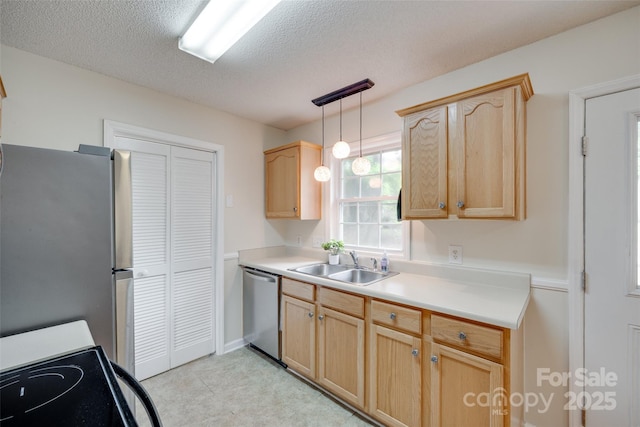110 Eighth St, York, SC 29745 - kitchen with appliances with stainless steel finishes, a sink, light brown cabinetry, and a textured ceiling