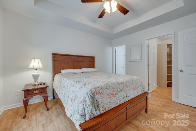 110 Eighth St, York, SC 29745 - bedroom with a raised ceiling, light wood-style floors, baseboards, and ceiling fan