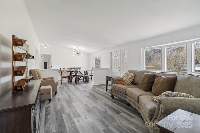 2315 Circle Dr, Great Falls, SC 29055 - living room with healthy amount of natural light, a chandelier, wood finished floors, and vaulted ceiling