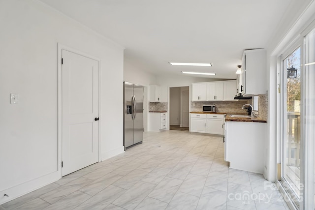 2315 Circle Dr, Great Falls, SC 29055 - kitchen featuring stainless steel appliances, backsplash, dark countertops, white cabinets, and a sink
