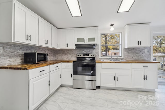 2315 Circle Dr, Great Falls, SC 29055 - kitchen with butcher block countertops, stainless steel electric stove, under cabinet range hood, a sink, and white cabinets