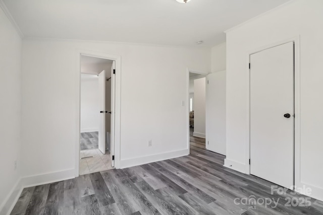 2315 Circle Dr, Great Falls, SC 29055 - unfurnished bedroom featuring crown molding, wood finished floors, and baseboards