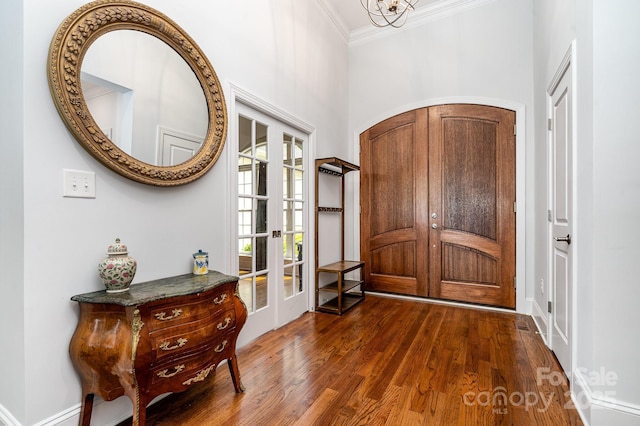 10874 Rise Ln, Fort Mill, SC 29707 - entrance foyer with french doors, crown molding, dark wood-style flooring, baseboards, and a chandelier