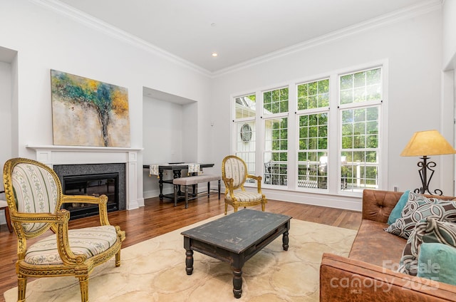 10874 Rise Ln, Fort Mill, SC 29707 - living area with ornamental molding, wood finished floors, a glass covered fireplace, and recessed lighting