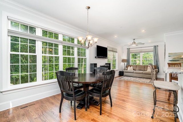 10874 Rise Ln, Fort Mill, SC 29707 - dining room with ornamental molding, baseboards, a chandelier, light wood finished floors, and a ceiling fan