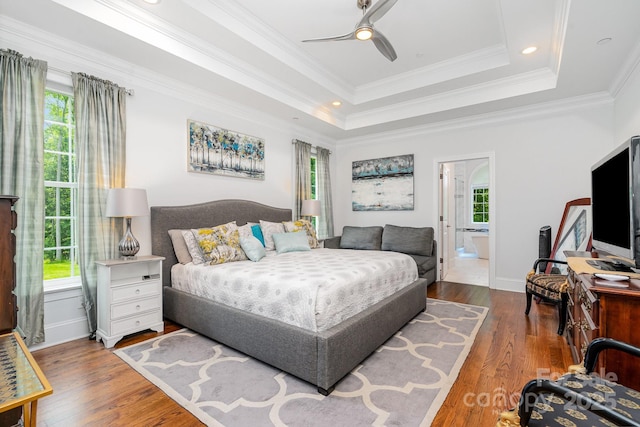 10874 Rise Ln, Fort Mill, SC 29707 - bedroom with multiple windows, wood finished floors, a tray ceiling, crown molding, and recessed lighting