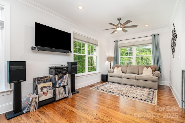 10874 Rise Ln, Fort Mill, SC 29707 - living area featuring crown molding, baseboards, wood finished floors, a ceiling fan, and recessed lighting