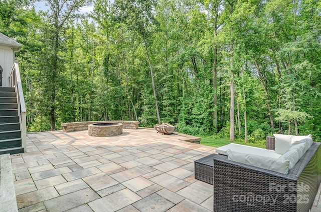 10874 Rise Ln, Fort Mill, SC 29707 - view of patio featuring stairway, an outdoor living space with a fire pit, and a forest view