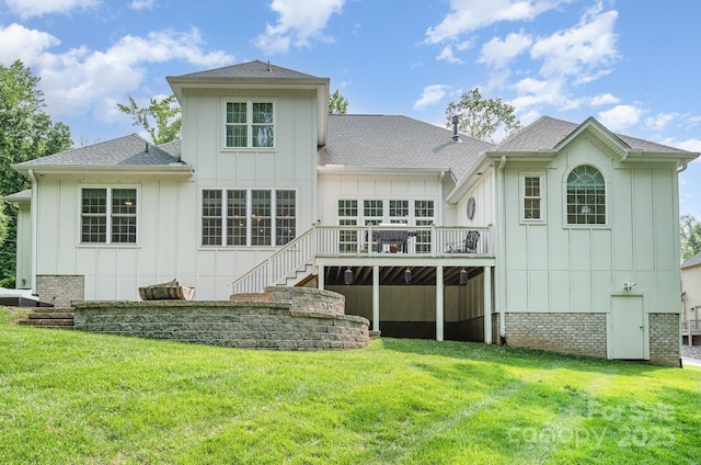 10874 Rise Ln, Fort Mill, SC 29707 - rear view of house with board and batten siding, a deck, stairway, and a yard